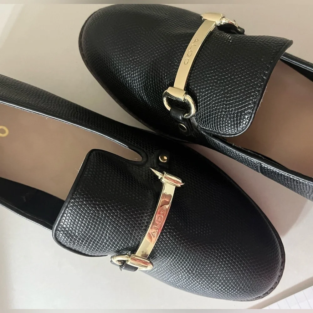 Aldo Yolanda Black Loafer with gold tone bar logo slight wedge size 10